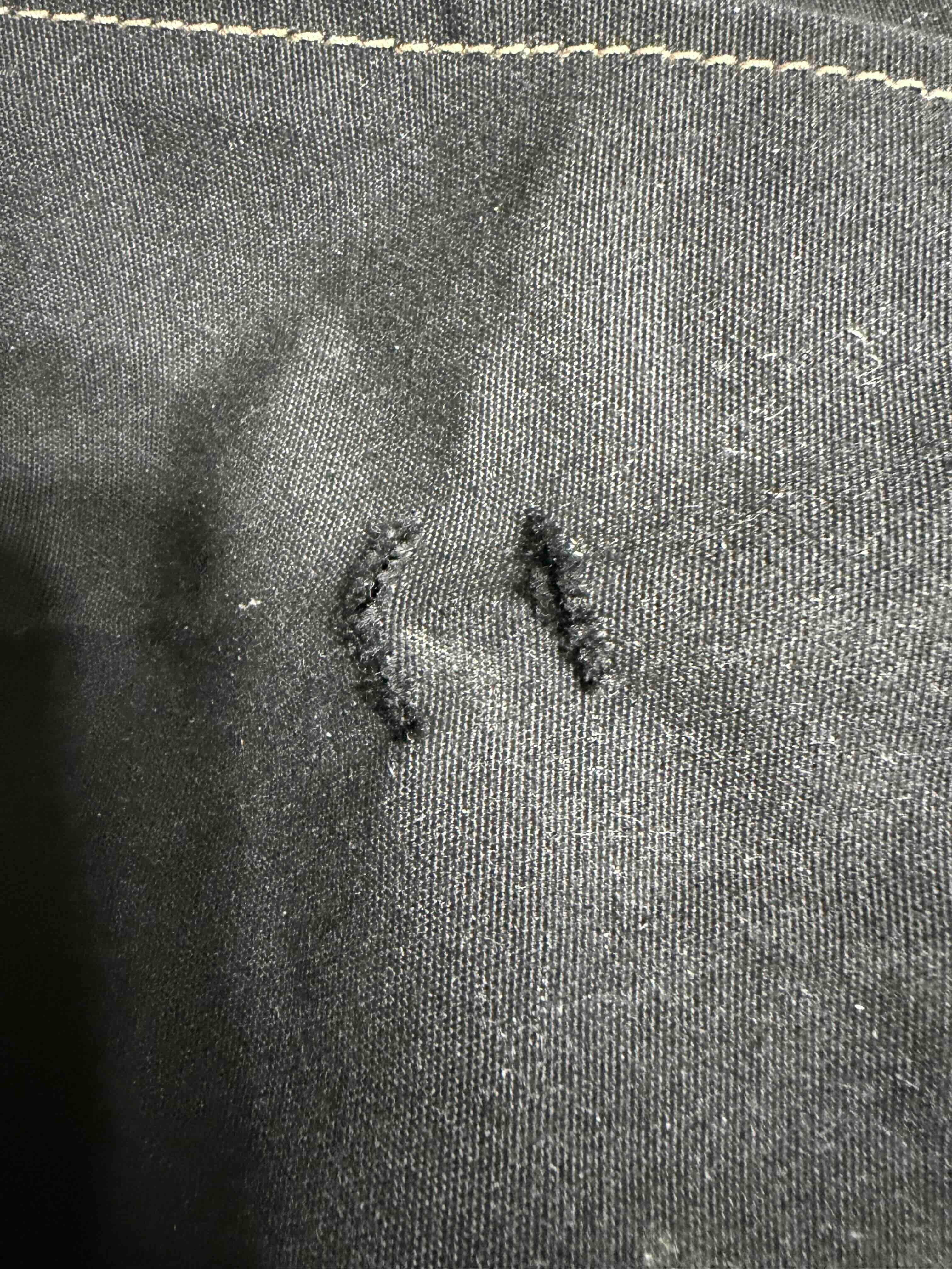 Small tears on cover - before repair